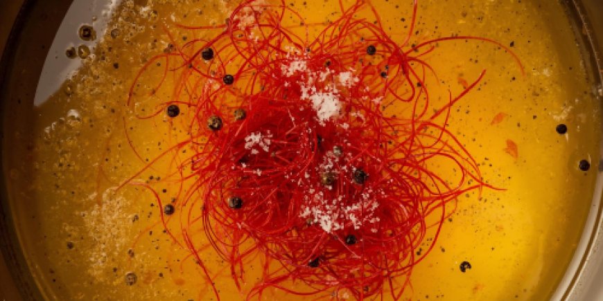 Add the broth and saffron.